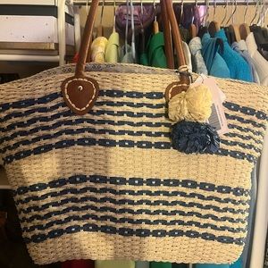 Cute summer straw beach tote bag with blue design and Pom poms